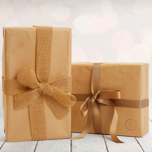Wrapped Personalised hamper tied with a brown ribbon