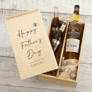 A Father's Day gift set containing a bottle of Glengoyne 10 Year Old Whisky, Fever-Tree mixers, and whisky stones, all presented in a personalized gift box with 'Happy Father's Day' and a name.