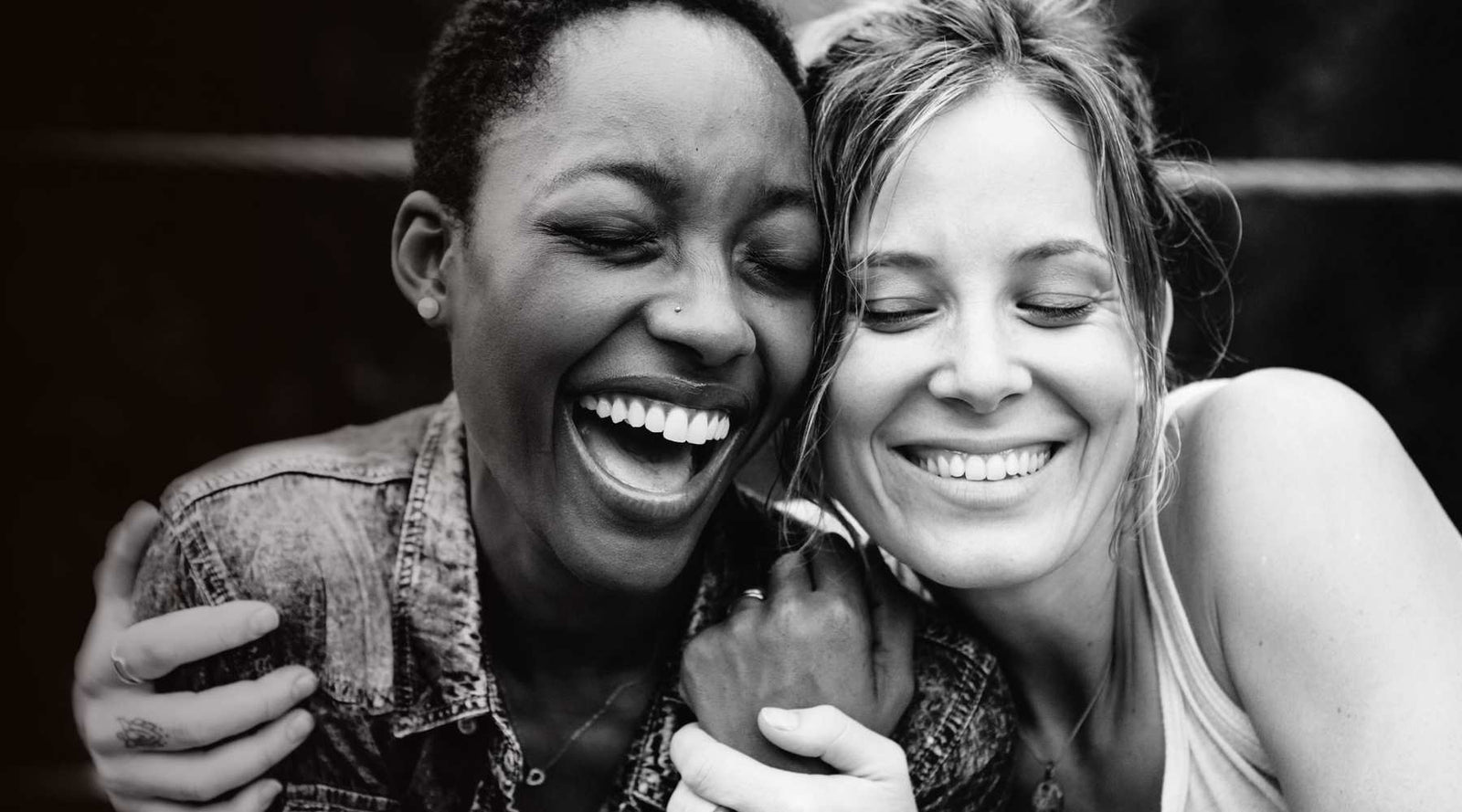 Galentines image of two ladies smiling and having a hug