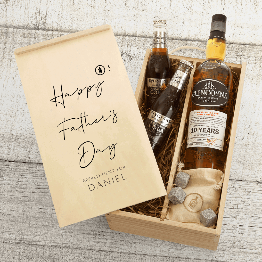 A Father&#39;s Day gift set containing a bottle of Glengoyne 10 Year Old Whisky, Fever-Tree mixers, and whisky stones, all presented in a personalized gift box with &#39;Happy Father&#39;s Day&#39; and a name.