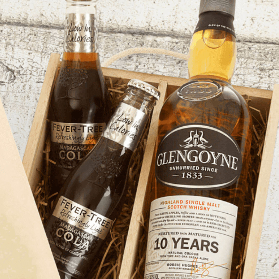 A Father's Day gift set containing a bottle of Glengoyne 10 Year Old Whisky, Fever-Tree mixers, and whisky stones, all presented in a personalized gift box with 'Happy Father's Day' and a name.