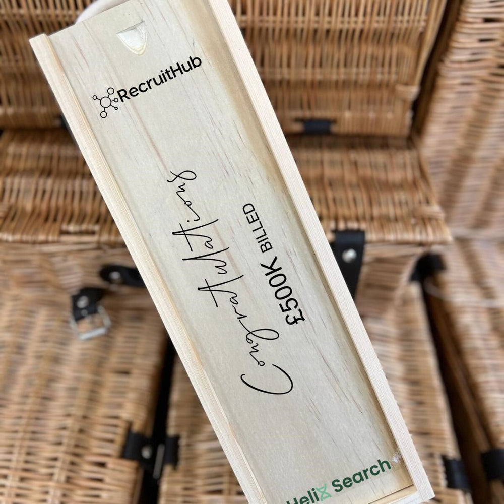 Personalised corporate gift box with a branded label and spirit bottle, hand-finished by SpiritSmith