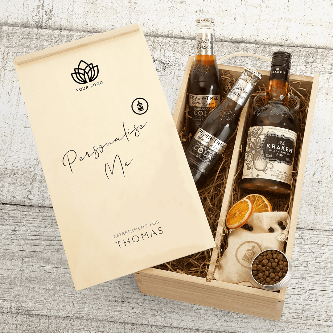 A personalised corporate gift box containing bottles of gin and tonic, with a personalised message card displaying the name 'Lucy'. The box is labeled with a placeholder for a company logo.